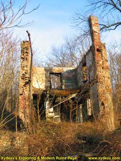 Front view of old abandoned house.